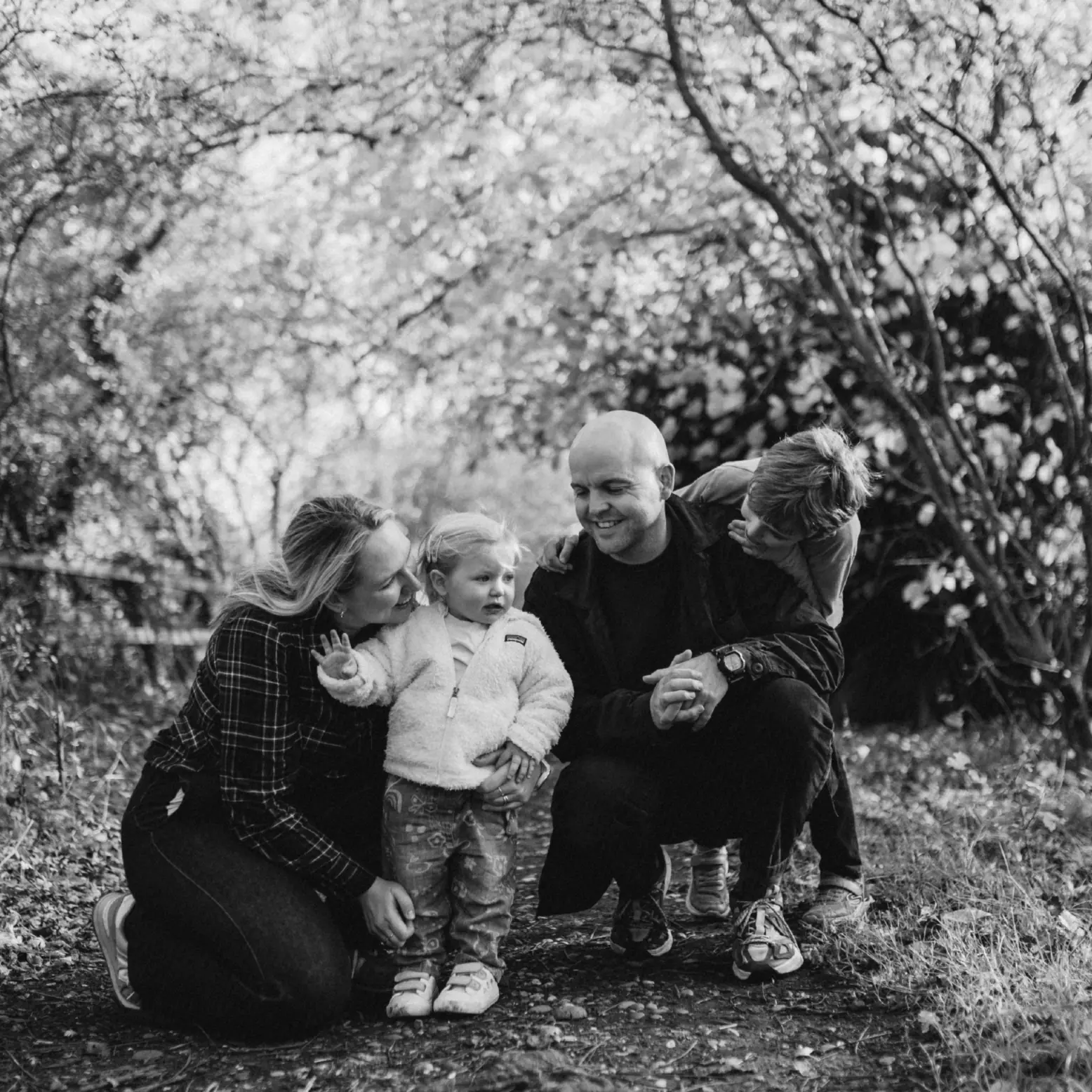 Black and white family photo outdoors